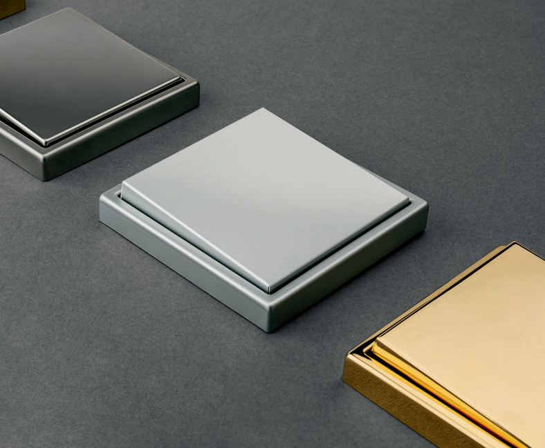 Premium metallic switch plates in dark, silver and gold